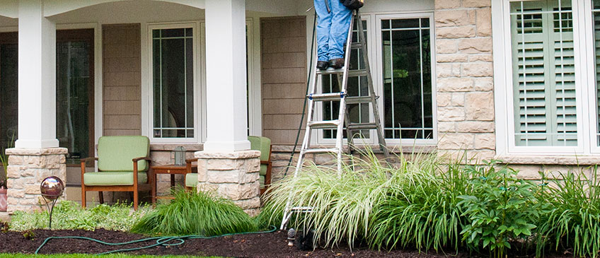 Victor had a hard time maneuvering the ladder around his landscaping