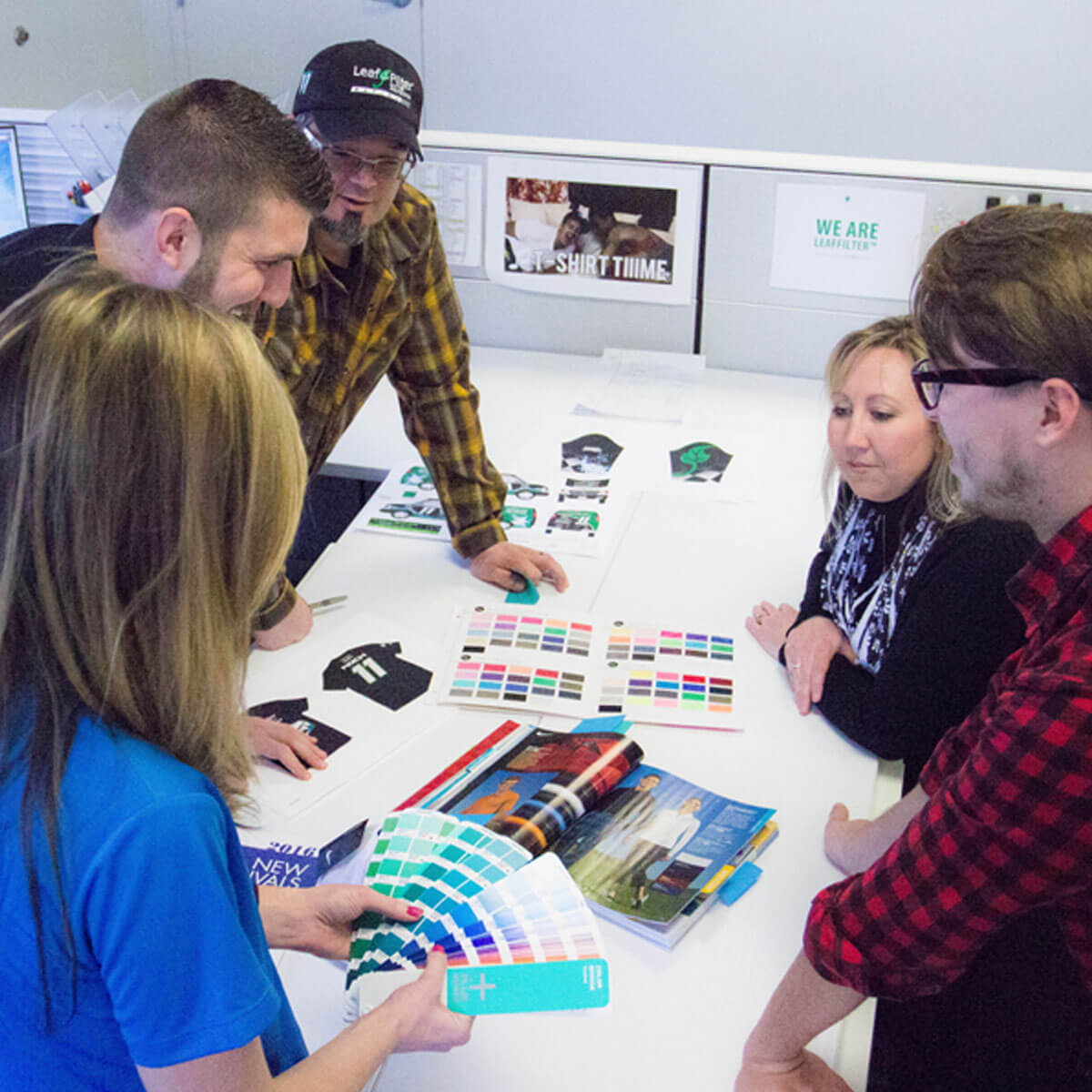 Five members of LeafFilter's Creative design team analyze color swatches