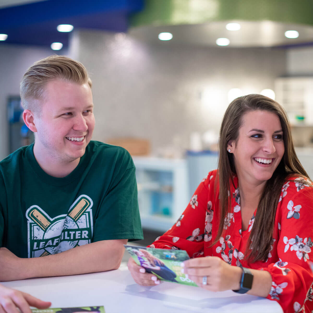 LeafFilter employees smiling at a table