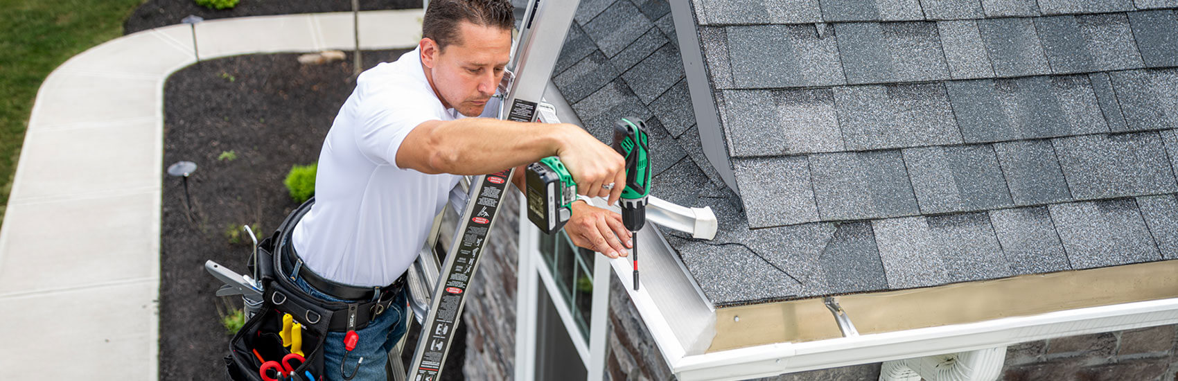 LeafFilter employee installing gutters on a home