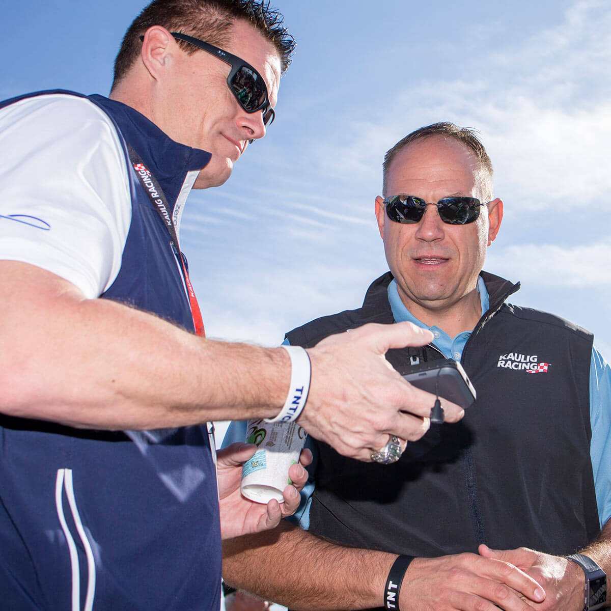 From left to right, Matt Kaulig and Chris Rice wear branded Kaulig Racing gear